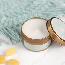 Load image into Gallery viewer, A hand-poured soy candle titled "Glow" from the "Any Occasion" gift box. The set also includes a cheerful greeting card with the message "Hello Sunshine," vibrant Ray of Sunshine Lemondrops, and a charming faux succulent, perfect for brightening any day