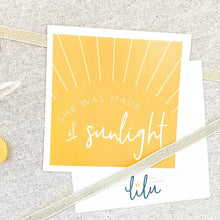 Load image into Gallery viewer, A beautifully designed greeting card titled "She Was Made of Sunlight" from the "Best Gal" gift box. The set also includes Ray of Sunshine Lemondrops, a soy candle, a coffee mug, and mini inspirational quote cards, all aimed at inspiring and uplifting