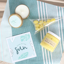Load image into Gallery viewer, Dive into relaxation with our 'Soak in the Sun' Spa gift box! Featuring a sunny greeting card, Ray of Sunshine Lemondrop candies, a soothing soy candle, and a luxurious Sugar Whip Scrub. Perfect for a beachy escape wherever you are! A perfect treat for yourself, a friend who could use some relaxation and self-care, or as a thoughtful gift for birthdays, celebrations or simply to show appreciation and care.
