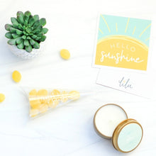 Load image into Gallery viewer, A gift box featuring a cheerful greeting card with the message &quot;Hello Sunshine,&quot; vibrant Ray of Sunshine Lemondrops, a charming faux succulent (may vary), and a soothing soy candle. Perfect for brightening someone&#39;s day with a touch of warmth and positivity.
