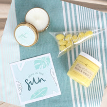 Load image into Gallery viewer, Dive into relaxation with our &#39;Soak in the Sun&#39; Spa gift box! Featuring a sunny greeting card, Ray of Sunshine Lemondrop candies, a soothing soy candle, and a luxurious Sugar Whip Scrub. Perfect for a beachy escape wherever you are! A perfect treat for yourself, a friend who could use some relaxation and self-care, or as a thoughtful gift for birthdays, celebrations or simply to show appreciation and care. 
